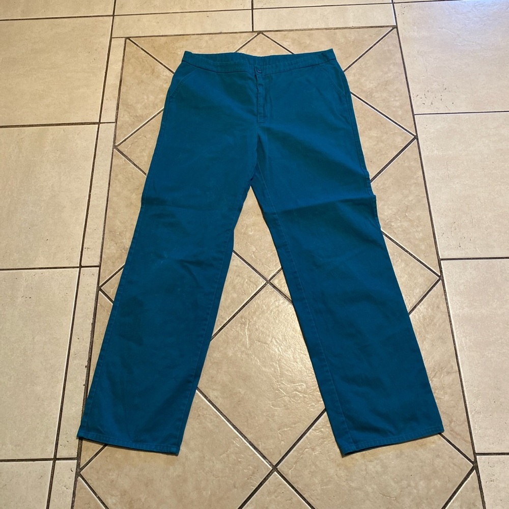 Teal work wear pants.